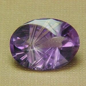 Amethyst Oval Fantasy YingYang 16x12mm 6.52crts